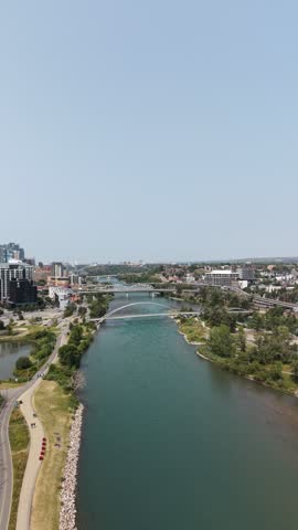 Aerial view of the Bow River and surrounding urban landscape in Calgary, Alberta, Canada.