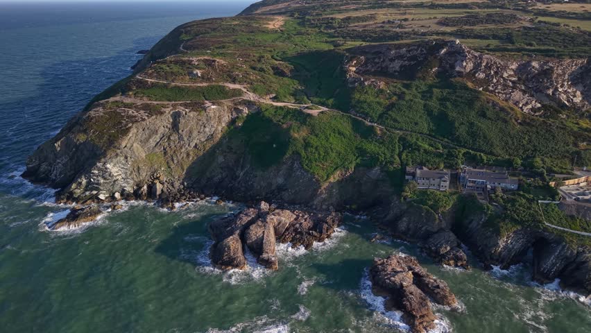 Breathtaking aerial of Howth coastal cliffs and cliff walk, Dublin, Ireland