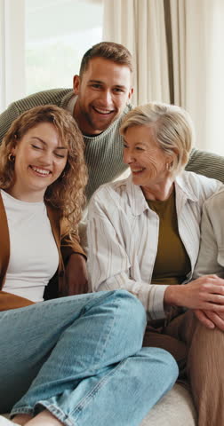 Big family, face and smile on sofa with love, support and bonding in living room of home to relax. Retirement, senior parents and adult son with happy, portrait and couch in lounge for relationship