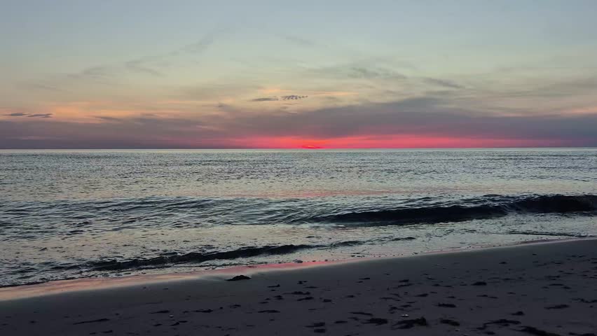 Beautiful Sunset Over The Baltic Sea In Latvia. Golden Sunlight Reflects On Calm Waves, Creating A Peaceful Coastal Landscape With Colorful Sky, Natural Beauty And Relaxing Summer Evening Atmosphere