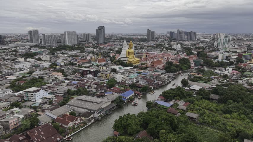 Wat Paknam Bhasicharoen golden big Buddha at the Chao Phraya River. Bangkok, Thailand