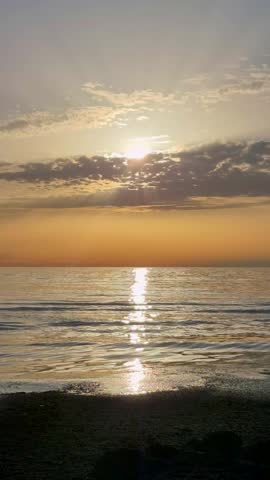 Beautiful Sunset Over The Baltic Sea In Latvia. Golden Sunlight Reflects On Calm Waves, Creating A Peaceful Coastal Landscape With Colorful Sky, Natural Beauty And Relaxing Summer Evening Atmosphere