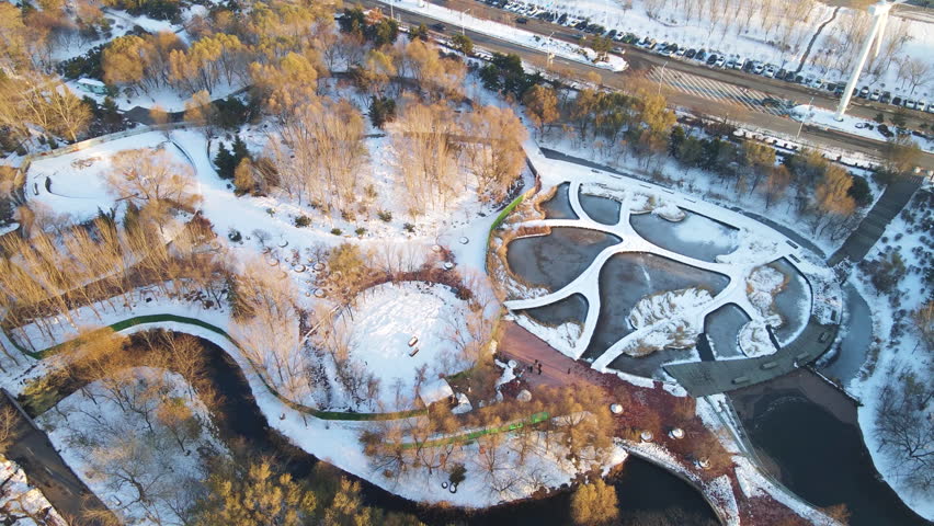 Snow Covered Northern Water Forest Park 4K Aerial