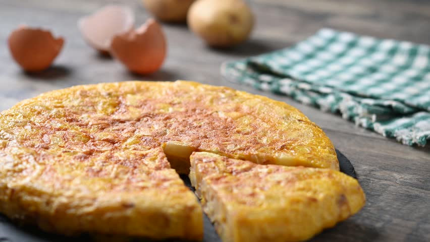 Spanish potato omelette on wooden table
