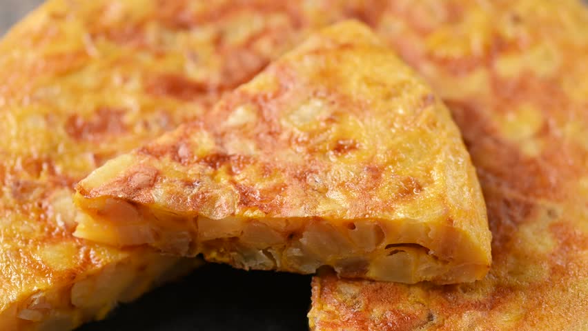 Spanish potato omelette on wooden table