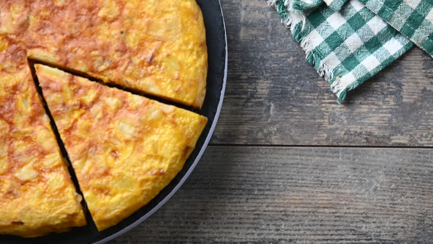  Spanish potato omelette rotating on plate