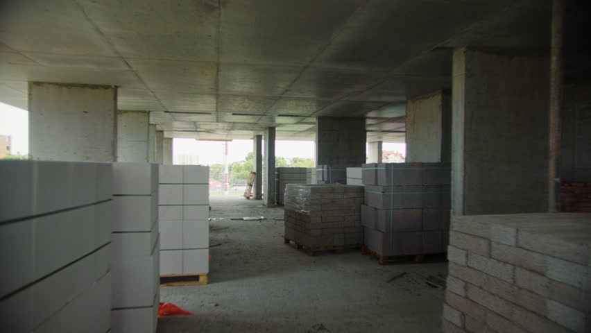Unfinished concrete building interior under construction