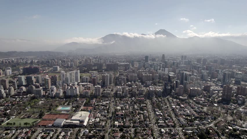Aerial Drone Forward Flight Toward Cloud-Covered Hills In Santiago De Chile