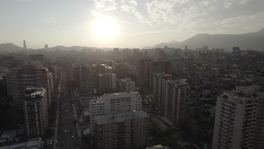 Cinematic Drone View Of Santiago City And Andes Range During Golden Hour
