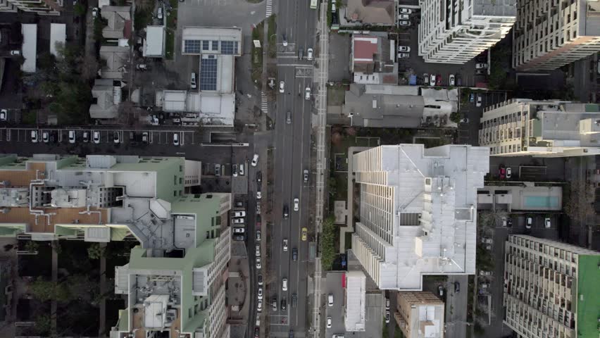 Overhead Drone View Tracking A Road Ending At Traffic Circle In Santiago Chile