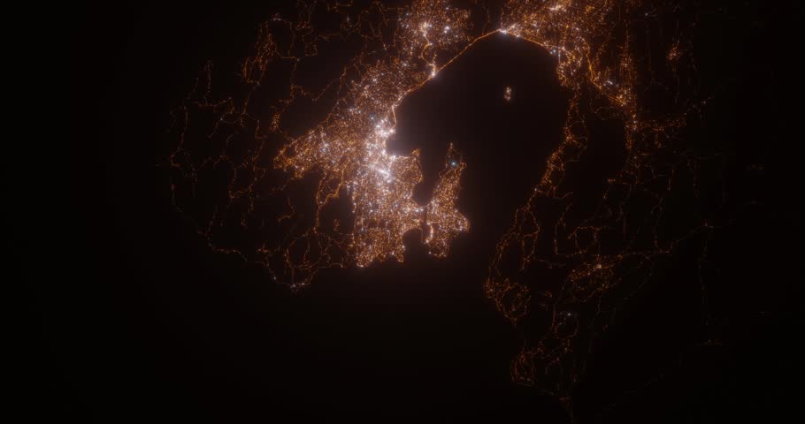 Wellington (New Zealand) aerial view at night. Satellite view on modern city with street lights. Camera is flying above the city, moving forward
