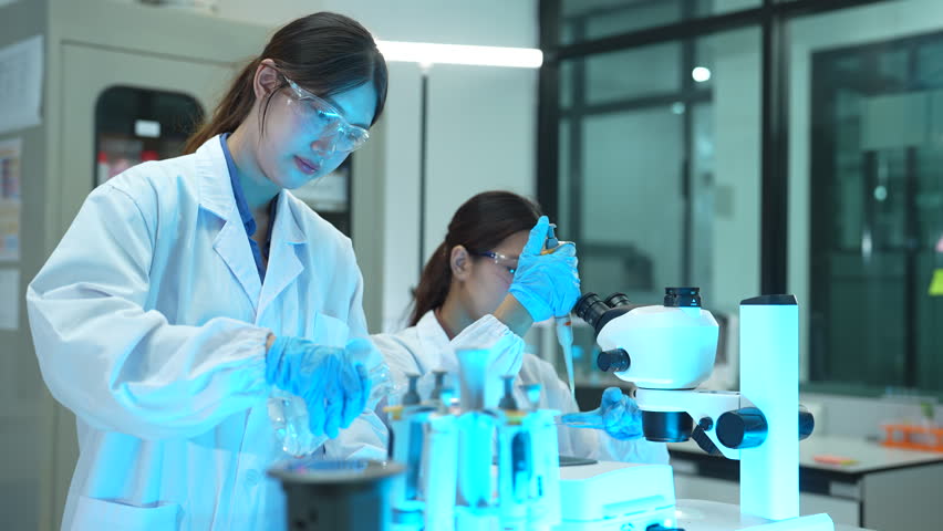 Researcher testing water purity through a microscope, monitoring soil moisture and crop health in a modern laboratory, advancing agricultural science and sustainability.