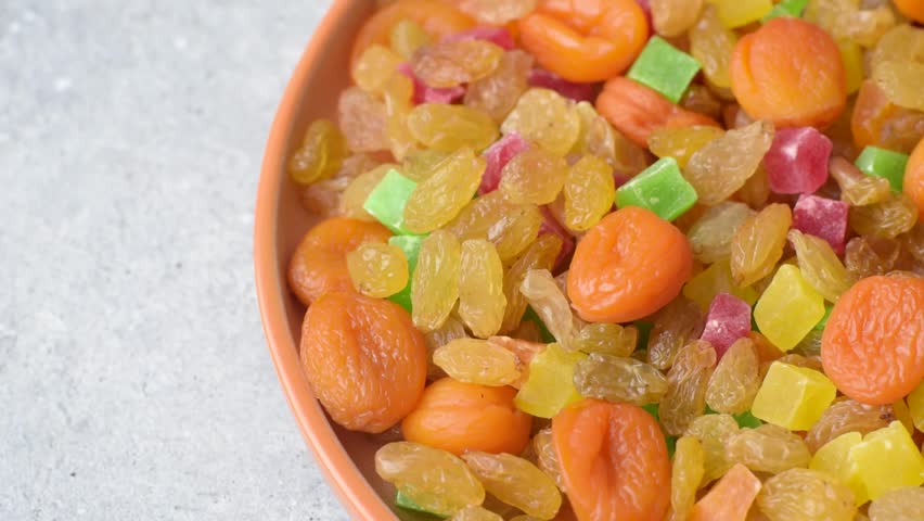 Dried apricots, raisins, and candied fruits as ingredients for baked goods and sweets. Dried fruits