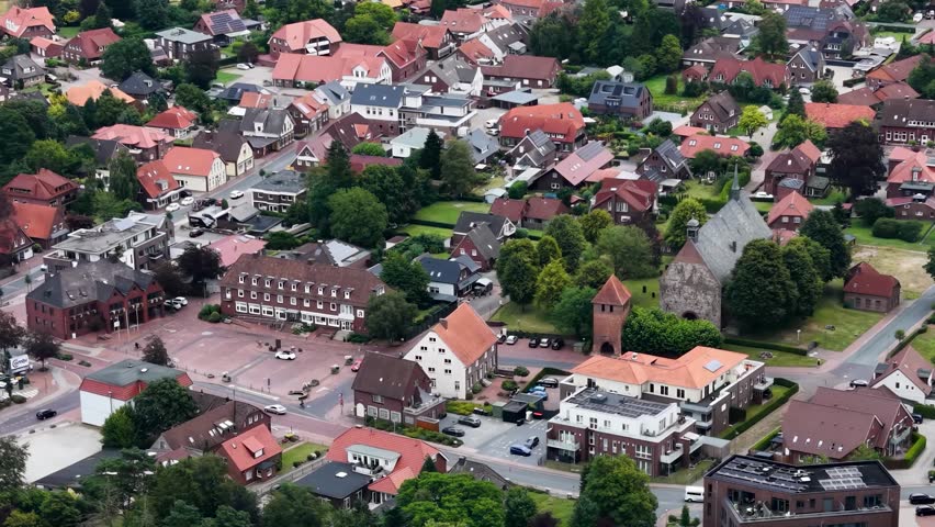 A panorama aerial view of the city Bockhorn above the old town on a cloudy summer noon in Germany