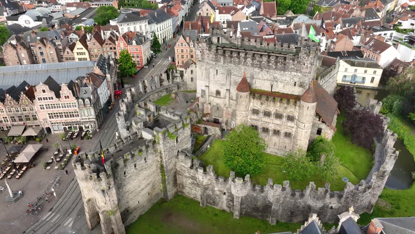 Aerial drone view of Ghent old town in Belgium, with the towers of St. Nicholas and St. Michael