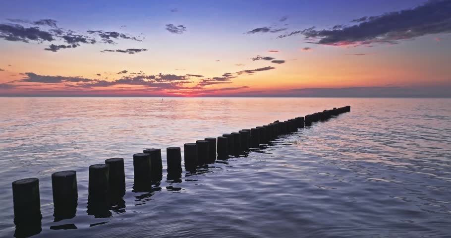 Stunning sunset in summer at Baltic sea in Poland. Vacation at the seaside.