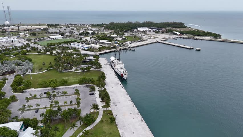 Key West, Florida, USA - view from airplane of waterfront, harbor, park, and ocean with a ship docked along the coast. g.