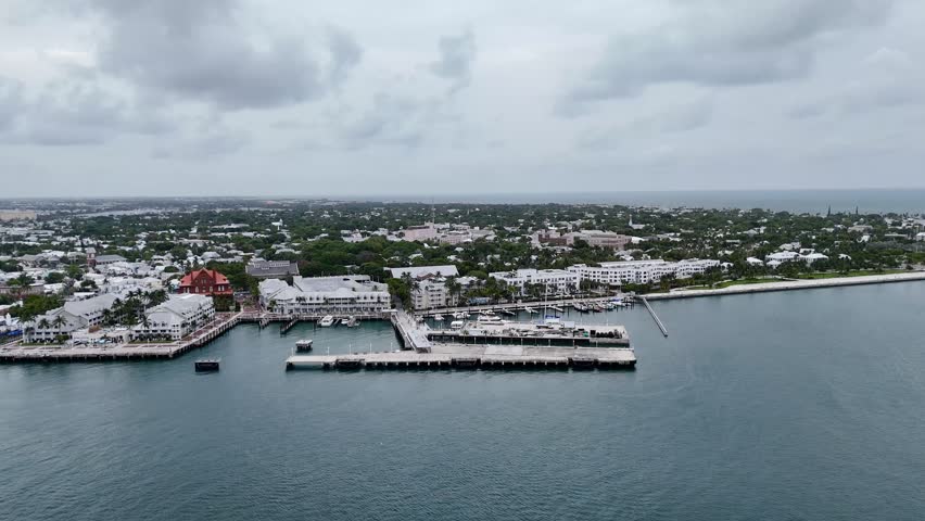 Key West, Florida, USA - view from airplane of waterfront, harbor, park, and ocean with a ship docked along the coast. g.