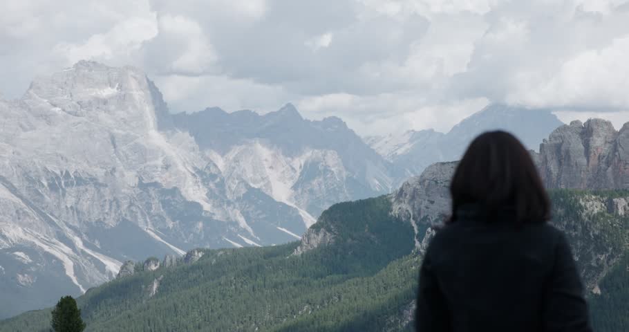 A woman viewing the scenic landscape at Cinque Torri near Cortina d