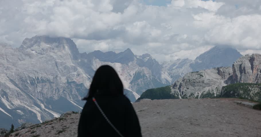A woman hiker enjoying the scenic landscape at Cinque Torri near Cortina d