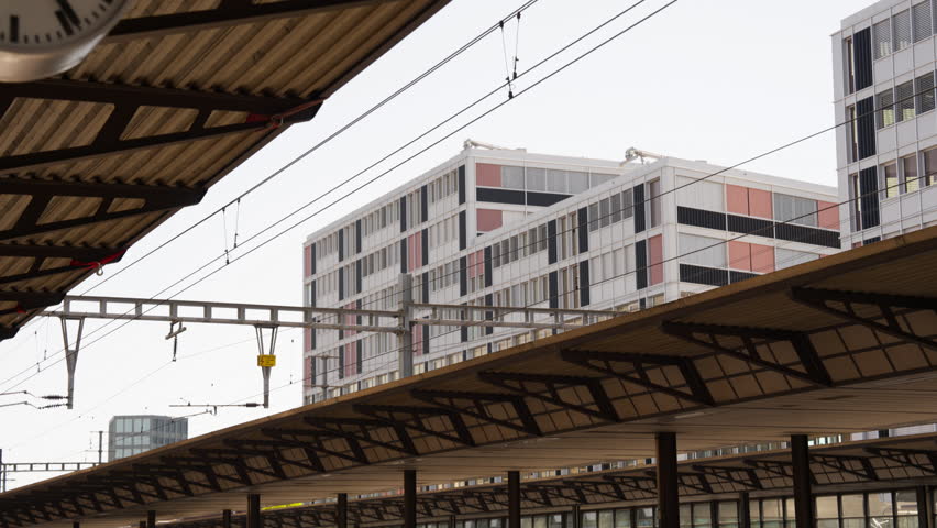 View of a building next to a Swiss with train station