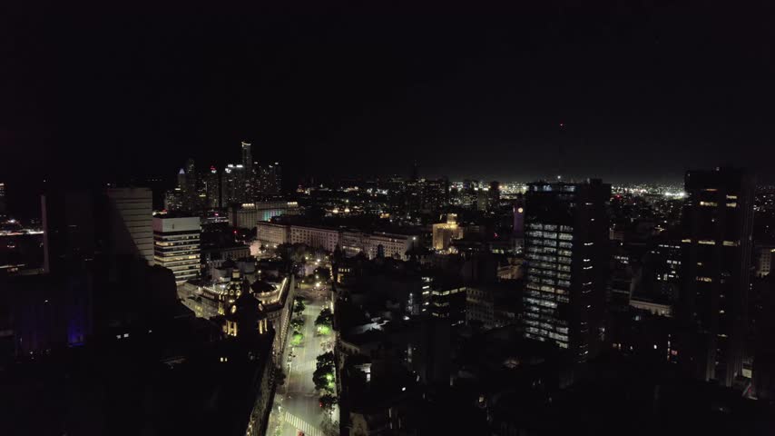 4K drone aerial view of downtown Buenos Aires, Argentina at night. Illuminated avenues, modern buildings and vibrant city life in one of South America’s largest capitals.