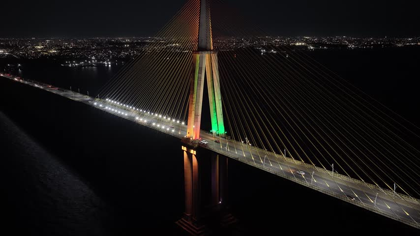 Night Cable Bridge At Manaus In Amazonas Brazil. Illuminated Bridge. Downtown District. Traffic Lights. Cable Bridge In Manaus In Amazonas Brazil. Beautiful Skyline. Illuminated Bridge.