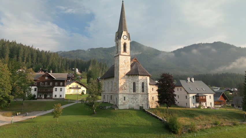 Aerial view of the historic church in the picturesque Gosau village, Austria, Austrian Alps.