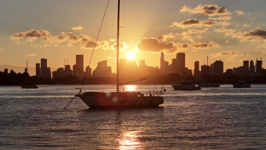 Sunset Bay At Miami Beach In Florida United States. Sunset City. Illuminated Cityscape. Downtown District. Sunset Bay At Miami Beach In Florida United States. Peaceful Sunset Sky.
