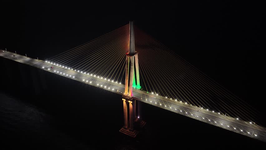 Night Cable Bridge At Manaus In Amazonas Brazil. Illuminated Bridge. Downtown District. Traffic Lights. Cable Bridge In Manaus In Amazonas Brazil. Beautiful Skyline. Illuminated Bridge.