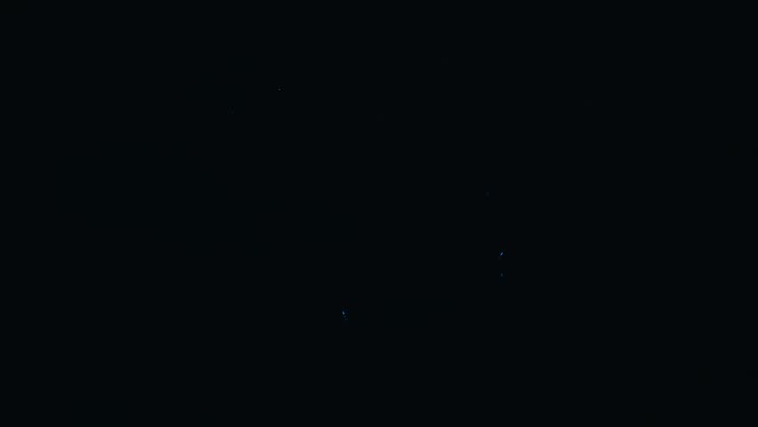 Beautiful blue fireworks exploding in the night sky