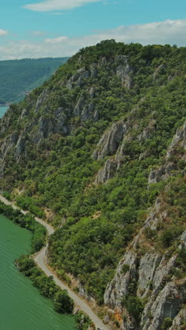 Aerial view on the Danube river and mountains in Iron Gate, Djerdap National Park, Serbia Romania border. Vertical video 4k