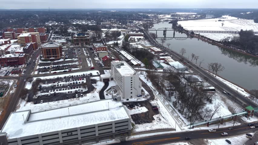 Aerial orbit of a hotel and arena in downtown Clarksville Tennessee