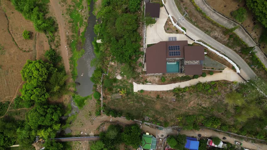 Top view of a Farm house. Cinematic drone flight over a dome house in Tanay Rizal capturing the peaceful mountain environment near Pililla River and surrounding countryside.