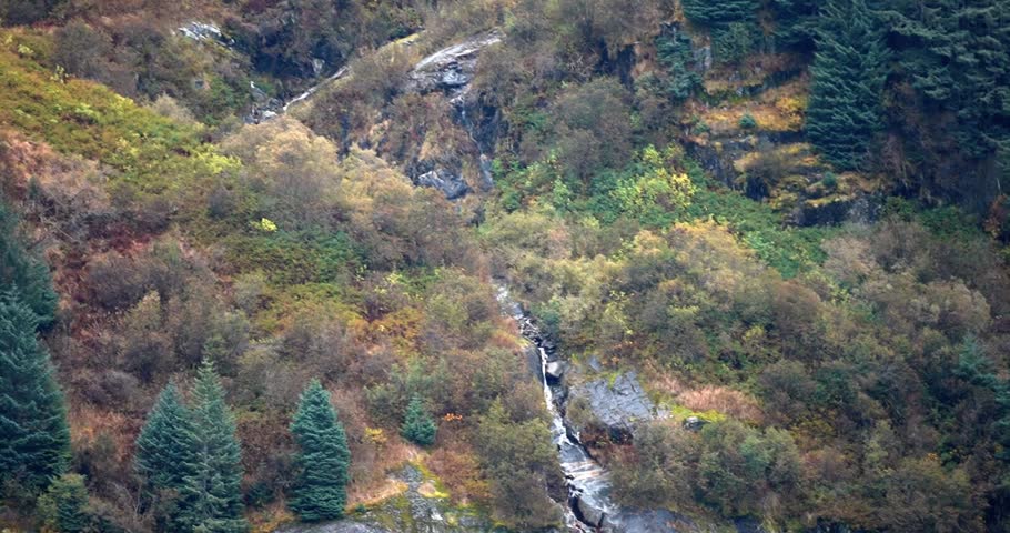 Waterfall on cliffside of Tracy Arm Fjord, Alaska during fall