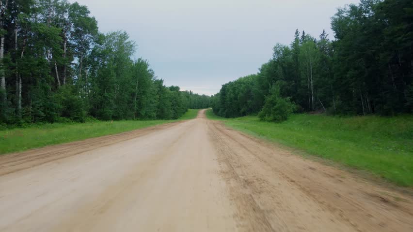 Rising Drone View Above Gravel Road Near South Wabasca Lake