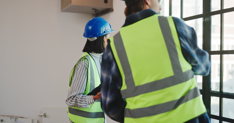 Construction, team and measuring tape with tablet for inspection, building evaluation and renovation. Woman, partner and software for window dimensions for architecture assessment, talking and tech