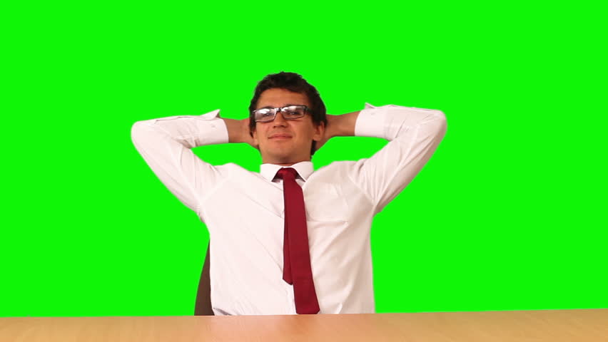 businessman seating on a chair on green screen