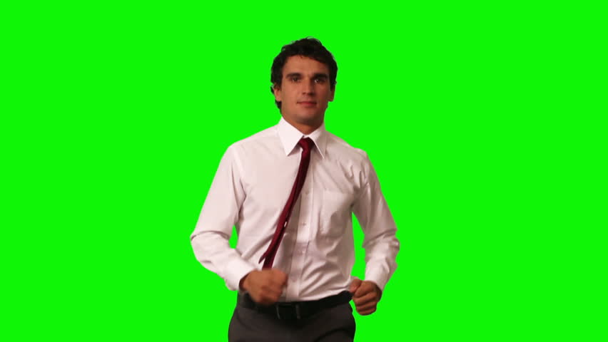 running businessman on green screen
