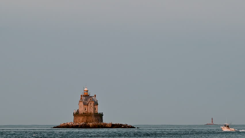 Fishers Island, NY, USA - Seagulls In Flight with Race Rock and Little Gull Island Lighthouses