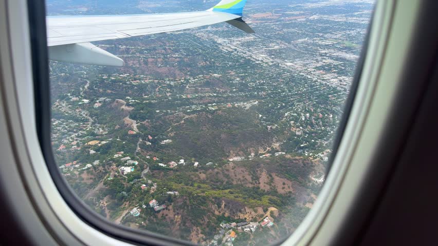 Los Angeles Hills and Neighborhoods POV from Airplane Window