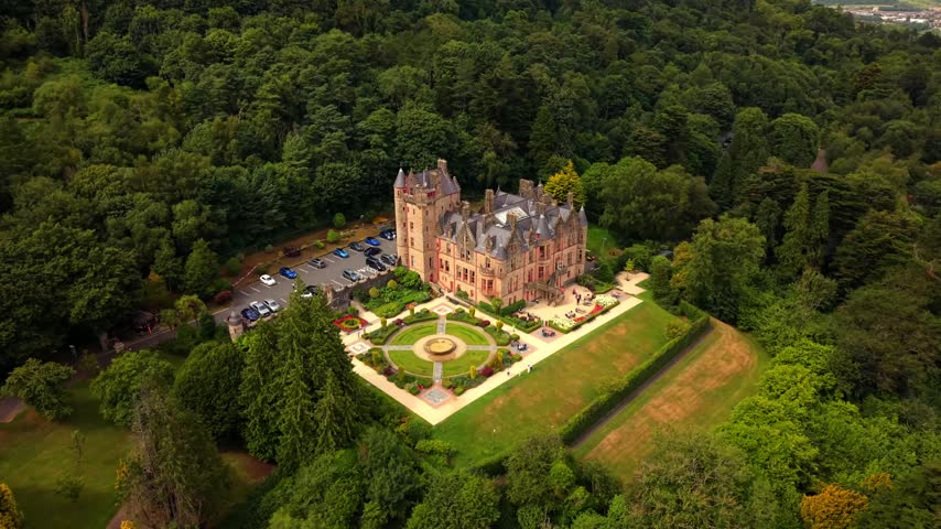 Clockwise 4K 60FPS aerial video of Belfast Castle and Cavehill in North Belfast, Northern Ireland in the UK on a bright sunny day. Produced with Rec709 colour.