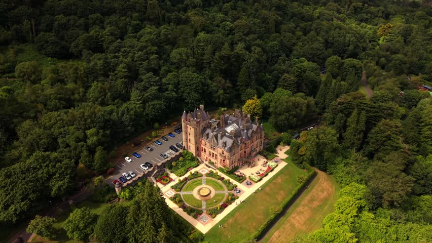 Rising 4K 60FPS aerial video of Belfast Castle and Cavehill in North Belfast, Northern Ireland in the UK on a bright sunny day. Produced with Rec709 colour.