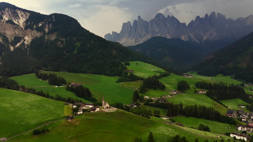 Landscape village Santa Maddalena in mountain valley at sunset in Dolomites, Italy. St. Magdalena and mountains. Val di Funes 
