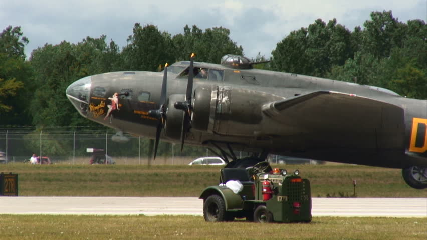 Flying Fortress WWII bomber starting up its engines.