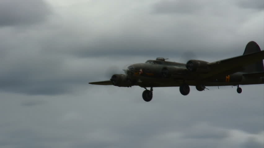 Flying Fortress WWII bomber landing.