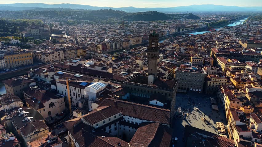 aerial Drone Golden Hour View of Palazzo Vecchio Tower Over Historic Florence Italy Cityscape