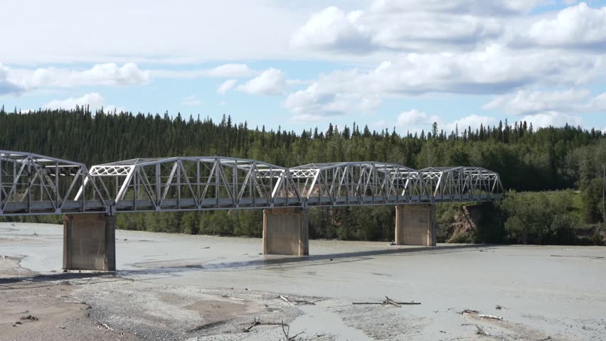Robertson River Bridge crossing a wide riverbed in Alaska