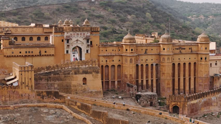 Historical amber fort, an ancient landmark in jaipur, rajasthan, india, with mountains in the background.