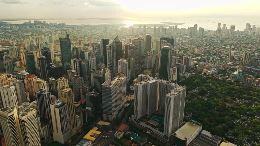 Golden Hour View Across Makati Financial District And Manila Bay Coast